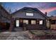 Charming brick home with a well-maintained lawn and beautiful architectural details on a sunny day at 2541 Cherry St, Denver, CO 80207