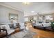 Bright living room with hardwood floors, fireplace, and stylish decor at 2541 Cherry St, Denver, CO 80207