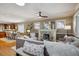 Cozy living area with a stone fireplace, modern furnishings, and hardwood floors at 2541 Cherry St, Denver, CO 80207