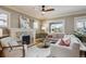 Bright living room with a fireplace, modern decor, and hardwood floors at 2541 Cherry St, Denver, CO 80207