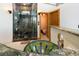 Bathroom with glass shower, custom vanity with vessel sink and unique design elements at 167 Independence Cir, Breckenridge, CO 80424
