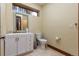 Neutral bathroom with vanity and toilet and window offers a clean and functional design at 167 Independence Cir, Breckenridge, CO 80424