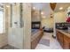 Modern bathroom featuring shower, bathtub with fireplace, vanity, and bed in a spacious, contemporary design at 167 Independence Cir, Breckenridge, CO 80424