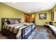 Stylish bedroom features a bed with soft lighting and a painting, offering a comfortable retreat at 167 Independence Cir, Breckenridge, CO 80424