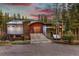 Stunning exterior elevation of a wooded home featuring a unique design and mountain views at 167 Independence Cir, Breckenridge, CO 80424