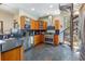 Kitchen featuring stainless steel appliances, natural wood cabinets, and unique staircase at 167 Independence Cir, Breckenridge, CO 80424