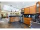 Open kitchen with wood cabinets, stainless steel appliances, and a view to the living room at 167 Independence Cir, Breckenridge, CO 80424