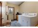 Functional laundry room with washer, dryer, sink, and door to outside provides convenience and utility at 167 Independence Cir, Breckenridge, CO 80424