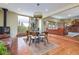 Living area with wood floors, a fireplace, and large windows with view at 167 Independence Cir, Breckenridge, CO 80424