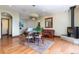 Comfortable living area with wood floors, fireplace, view to staircase and dining area at 167 Independence Cir, Breckenridge, CO 80424