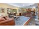 Open-concept living room flows into the kitchen, with hardwood flooring and exposed beams at 167 Independence Cir, Breckenridge, CO 80424