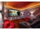 Home movie room with big screen, surround sound, theater seating, and comfortable beanbag chairs for immersive entertainment at 167 Independence Cir, Breckenridge, CO 80424