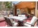 Inviting covered outdoor dining area offers table and seating, as well as a built-in grill at 167 Independence Cir, Breckenridge, CO 80424