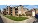 Condo building with balconies and green space. Great landscaping around the building and well maintained at 3035 Blue Sky Cir # 10-207, Erie, CO 80516