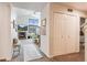 Bright living room with fireplace, closet, and carpeted floors. The room has a fireplace and a ceiling fan at 3035 Blue Sky Cir # 10-207, Erie, CO 80516