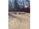 Exterior view of backyard with stone bench and red shed at 1473 S Monaco S Pkwy, Denver, CO 80224