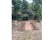 Charming backyard featuring an archway and brick-paved pathway, perfect for outdoor enjoyment at 1473 S Monaco S Pkwy, Denver, CO 80224