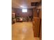 Spacious basement with storage and wood paneling; perfect for workshop or recreation at 1473 S Monaco S Pkwy, Denver, CO 80224