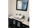 Modern bathroom vanity featuring a stylish vessel sink and sleek black faucet and hardware at 1473 S Monaco S Pkwy, Denver, CO 80224