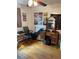 Neat bedroom with a vintage vanity and desk, complete with wooden floors and ample natural light at 1473 S Monaco S Pkwy, Denver, CO 80224