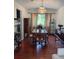 Dining room featuring hardwood floors, chandelier, and plenty of natural light at 1473 S Monaco S Pkwy, Denver, CO 80224