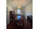 Elegant dining room with a large wooden table, stylish chairs, and decorative chandelier at 1473 S Monaco S Pkwy, Denver, CO 80224