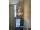 Elegant chandelier lighting up the entryway with view of door at 1473 S Monaco S Pkwy, Denver, CO 80224