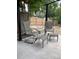 Back patio with comfortable furniture and overhead structure at 1473 S Monaco S Pkwy, Denver, CO 80224