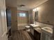 Functional bathroom featuring neutral walls, window, and updated vanity at 8319 Quivas Way, Denver, CO 80221