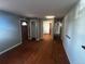 Spacious living room featuring hardwood floors, neutral walls, and a welcoming entry at 8319 Quivas Way, Denver, CO 80221