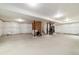 Unfinished basement, ready for customization, with exposed insulation, concrete floor, and stairs at 10913 Ledges Rd, Parker, CO 80134