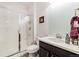 Clean bathroom with a glass-enclosed shower and a vanity with storage at 10913 Ledges Rd, Parker, CO 80134