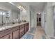 Bathroom with dual sinks, granite countertops, and modern fixtures at 10913 Ledges Rd, Parker, CO 80134