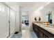 Bathroom features a glass enclosed shower and double sink vanity with granite countertops at 10913 Ledges Rd, Parker, CO 80134