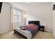 Cozy bedroom with carpet floors, natural light, and neutral paint colors at 10913 Ledges Rd, Parker, CO 80134