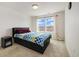 Bright bedroom with carpet, good natural light, and a platform bed frame at 10913 Ledges Rd, Parker, CO 80134