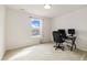 Bedroom featuring a large window with bright natural light and a desk for working from home at 10913 Ledges Rd, Parker, CO 80134