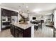 Elegant kitchen flowing into the dining area, showcasing an island, and stainless steel appliances at 10913 Ledges Rd, Parker, CO 80134