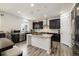 Stylish kitchen featuring a central island, stainless steel appliances, and rich, dark cabinetry at 10913 Ledges Rd, Parker, CO 80134