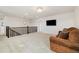 Spacious loft area with plush carpet, a cozy couch, and a relaxing ambiance at 10913 Ledges Rd, Parker, CO 80134