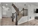 Elegant staircase with wood railings and carpeted steps, creating a welcoming entrance at 10913 Ledges Rd, Parker, CO 80134