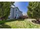 Large backyard with a well-maintained lawn and a deck, perfect for outdoor activities at 8888 S Dudley St, Littleton, CO 80128