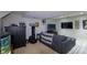 Finished basement with comfortable seating, entertainment center, and neutral decor at 8888 S Dudley St, Littleton, CO 80128