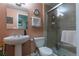 Charming bathroom features a classic pedestal sink and enclosed shower at 8888 S Dudley St, Littleton, CO 80128