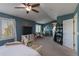 Spacious bedroom with a walk-in closet, a desk, and abundant natural light from large windows at 8888 S Dudley St, Littleton, CO 80128