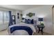 Charming bedroom features a plush bed, stylish decor, and abundant natural light, creating a serene retreat at 8888 S Dudley St, Littleton, CO 80128