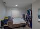 Cozy bedroom with white walls, closet and a large window at 8888 S Dudley St, Littleton, CO 80128