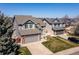 Beautiful two-story home with well-maintained lawn and attached two-car garage at 8888 S Dudley St, Littleton, CO 80128