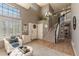 Inviting foyer features a staircase, hardwood floors, and plenty of natural light from large windows at 8888 S Dudley St, Littleton, CO 80128