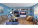 Comfortable living room with a large built-in media center and fireplace at 8888 S Dudley St, Littleton, CO 80128
